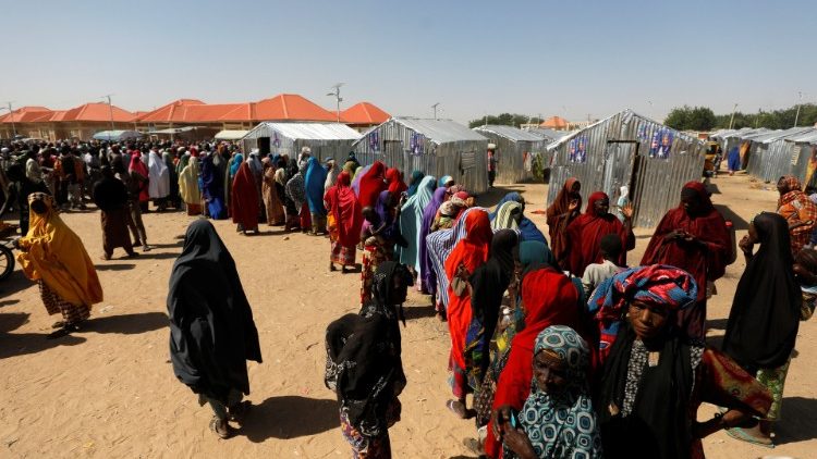 Women queue for relief at the Teachers' Village IDP camp in Maiduguri