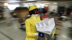 a-robot-wearing-a-nurse-costume-carries-medic-1549439333893.JPG