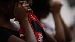 a-supporter-of-flamengo-reacts-during-a-mass--1549671301334.JPG