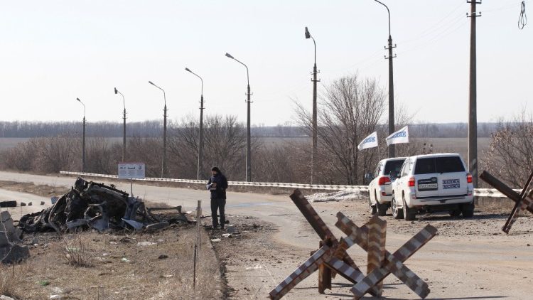 an-osce-member-examines-the-wreckage-of-a-min-1551021929232.JPG