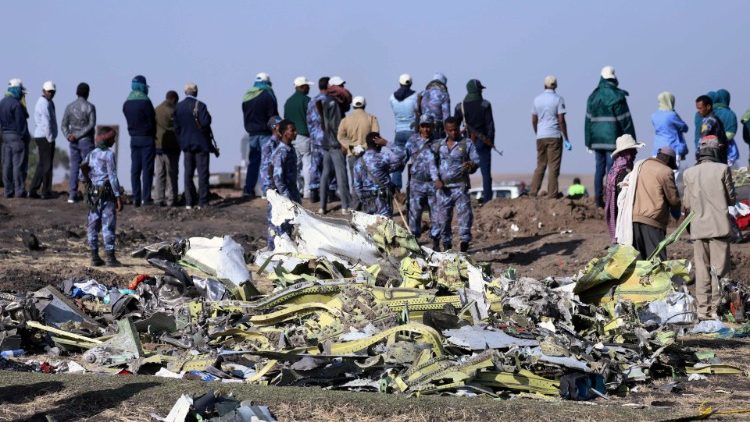 Ethiopian Federal policemen stand at the scene of the Ethiopian Airlines Fligh plane crash