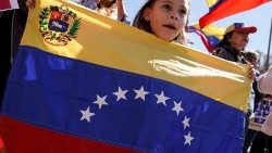 a-girl-displays-the-venezuelan-flag-as-oppone-1552766642316.JPG
