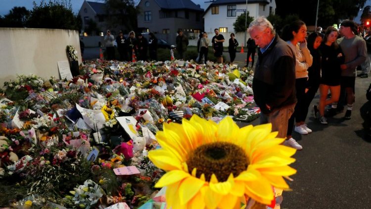 People visit a memorial site for victims of Friday's shooting, in front of the Masjid Al Noor mosque in Christchurch