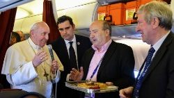 pope-francis-hands-a-cake-to-two-reporters-wh-1554060561836.JPG