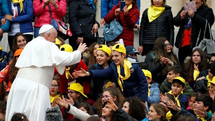 Pope Francis greets people during the weekly general audience in St. Peter's square at the Vatican