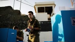 an-israeli-soldier-s-shadow-is-cast-on-a-mobi-1554650982316.JPG