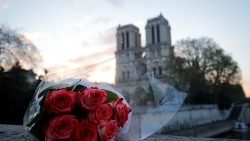 a-bunch-of-roses-placed-near-notre-dame-cathe-1555486477752.JPG