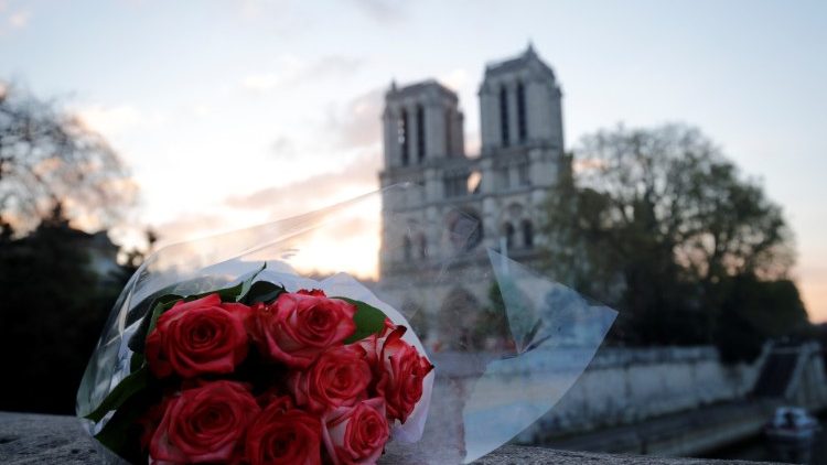 a-bunch-of-roses-placed-near-notre-dame-cathe-1555486477752.JPG