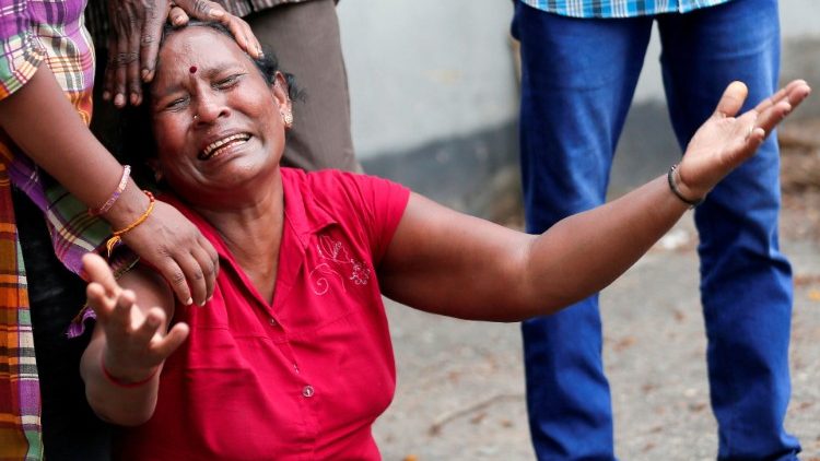 A relative of a victim of the explosion at St. Anthony's Shrine, Kochchikade church, reacts at the police mortuary in Colombo