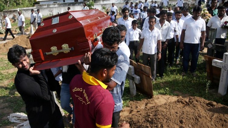 a-coffin-of-a-victim-is-carried-during-a-mass-1556015347858.JPG
