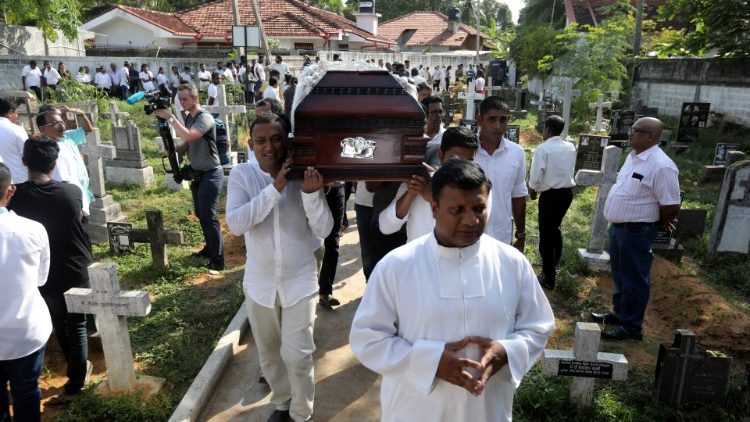 a-coffin-of-a-victim-is-carried-during-a-mass-1556015349866.JPG