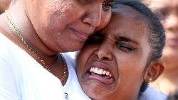 family-members-mourn-at-the-funeral-of-eight--1556102335841.JPG
