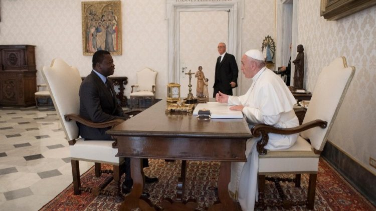 Pope Francis speaks with Togolese President Faure Essozimna Gnassingbe during a private audience at the Vatican