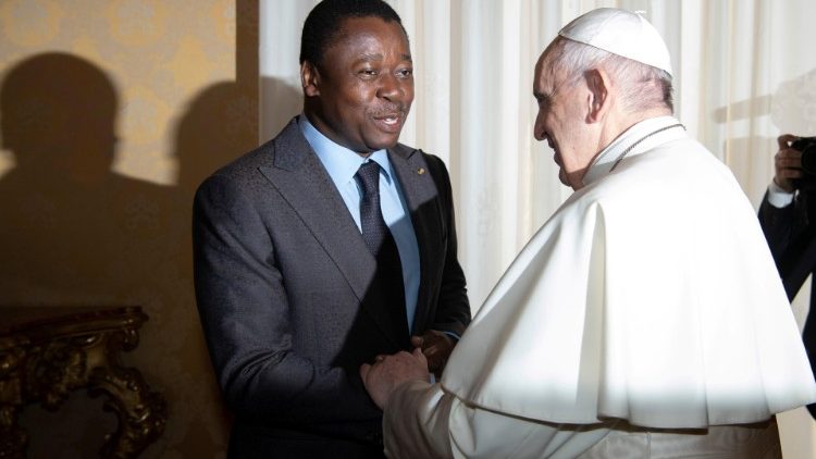 Togolese President Faure Essozimna Gnassingbe shakes hands with Pope Francis during a private audience at the Vatican.