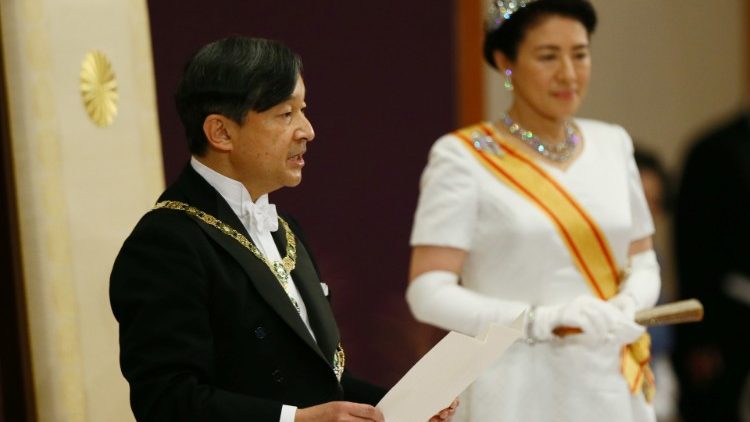 Japan's Emperor Naruhito, flanked by Empress Masako, delivers  his first speech as head of state. 