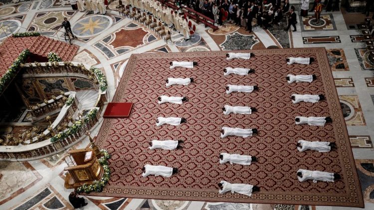 newly-ordained-priests-lie-on-the-floor-as-po-1557651855505.JPG