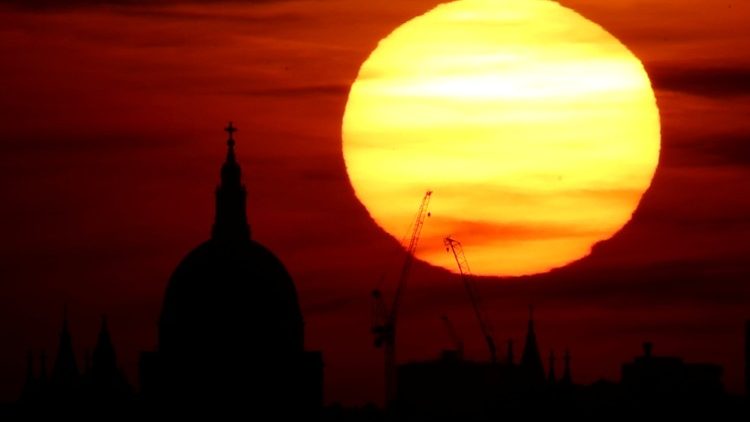 The sun behind St Paul's Cathedral in London