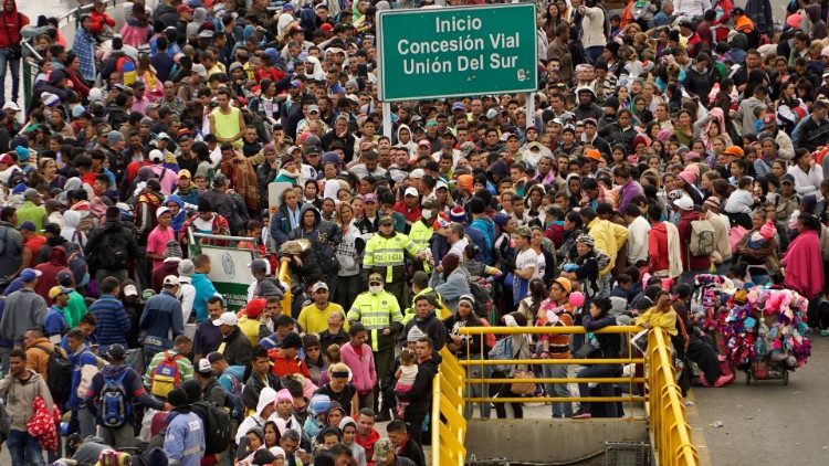 Venezuelan migrants gather to cross into Ecuador from Colombia, most of them trying to reach Peru