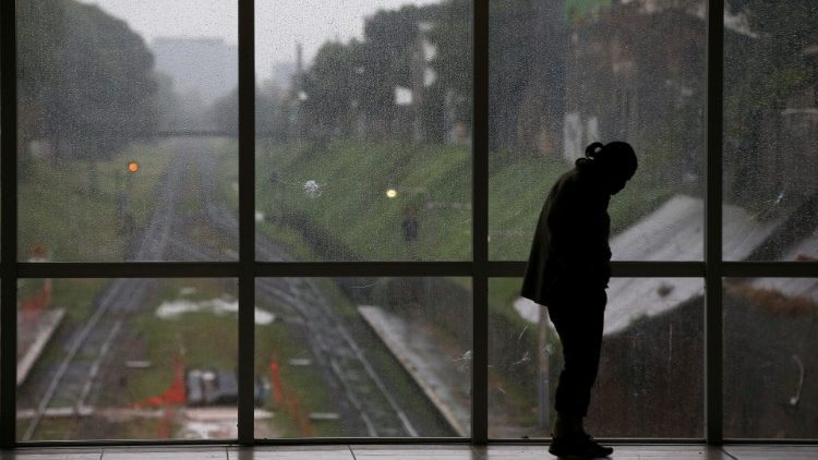 A man stands at the Aristobulo del Valle train station during a national blackout, in Buenos Aires
