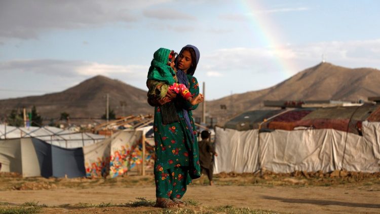 Internally displaced Afghan girl with child