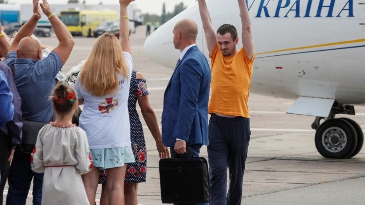 A recently exchanged Ukrainian prisoner is greeted upon arrival in Kiev