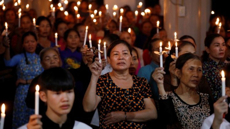 Catholics attend a mass prayer for 39 people found dead in the back of a truck near London, UK at My Khanh parish in Nghe An province