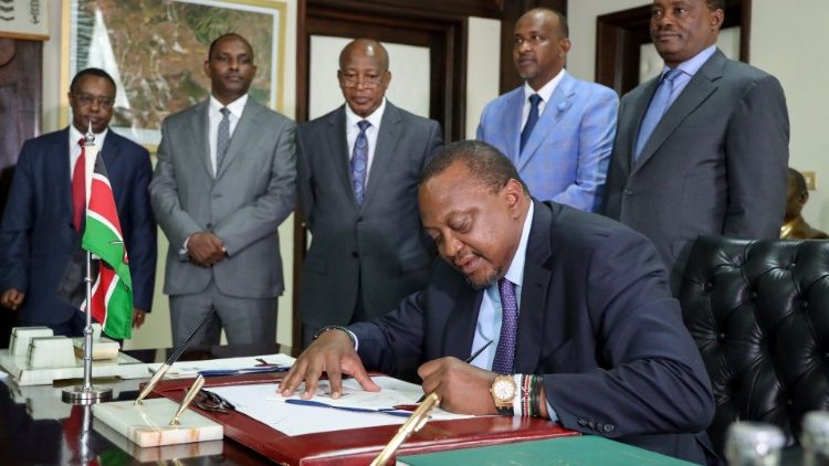 Kenya's President Uhuru Kenyatta signs into law the Finance Bill 2019 at State House in Nairobi