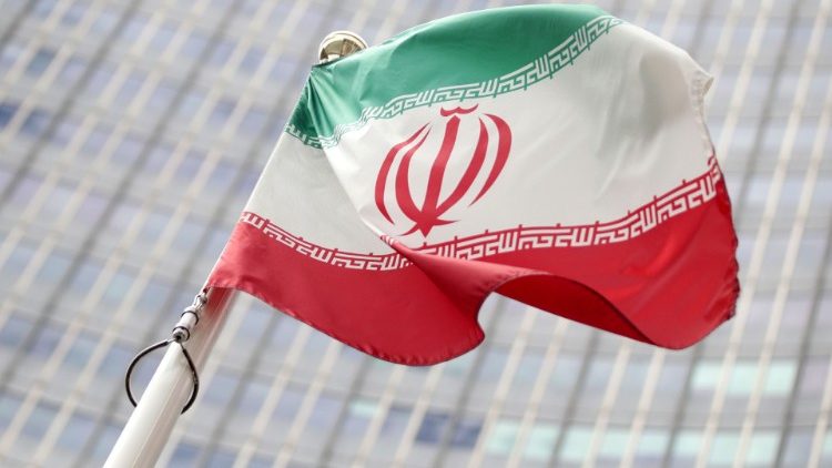 The Iranian flag flutters in front the International Atomic Energy Agency headquarters in Vienna