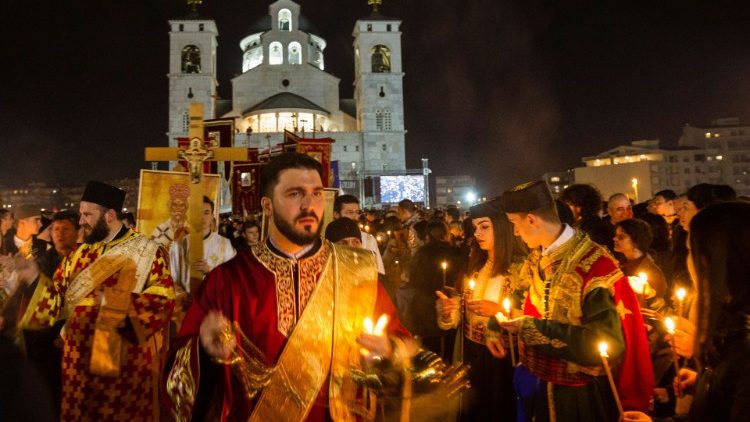 Serbian Orthodox Church clergy in Montenegro march in protest against a new law on religious freedom