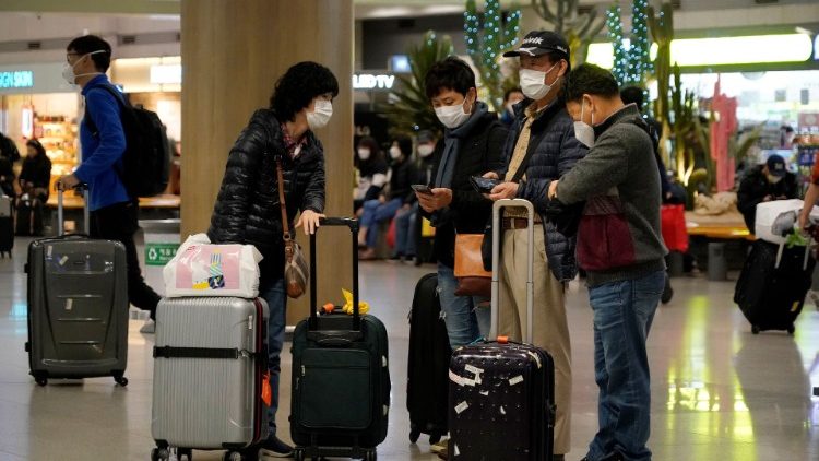 People wearing masks to prevent contracting coronavirus are seen at Incheon International Airport in Incheon
