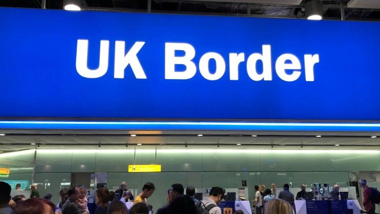 FILE PHOTO: Signage is seen at the UK border control point at the arrivals area of Heathrow Airport, London