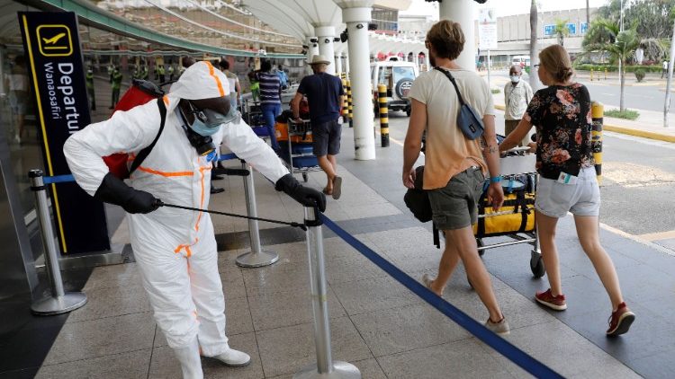 A health worker sprays disinfectant at the Jomo Kenyatta International Airport in Nairobi