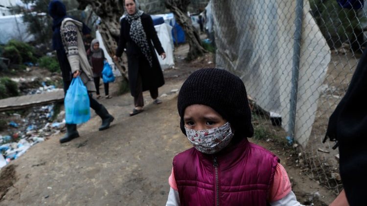 A girl at a makeshift camp for refugees and migrants next to the Moria camp in Lesbos, Greece