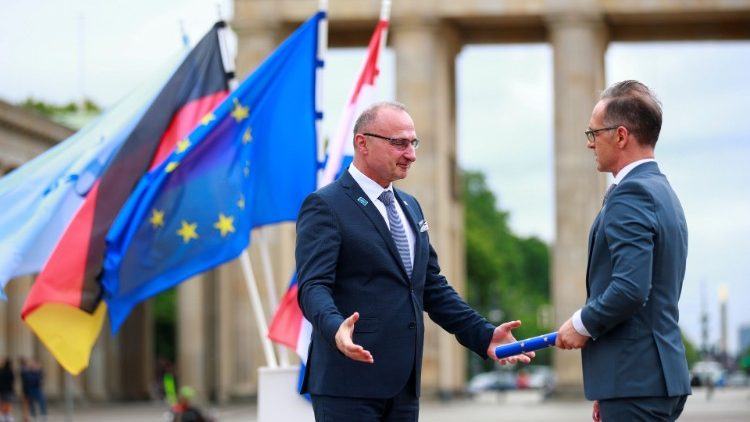 German Foreign Minister Heiko Maas (R) takes over the rotating EU presidency from Croatia