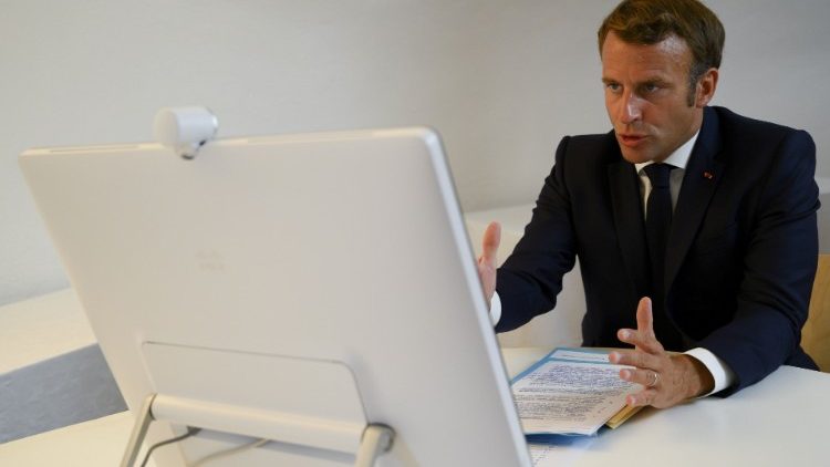 French President Emmanuel Macron speaks during a donor teleconference with other world leaders, in Bormes-les-Mimosas