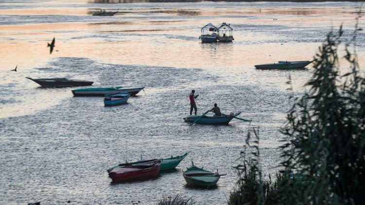 Fishermen are seen on a boat on the Nile River on the outskirts of Cairo, following the outbreak of the coronavirus disease (COVID-19)