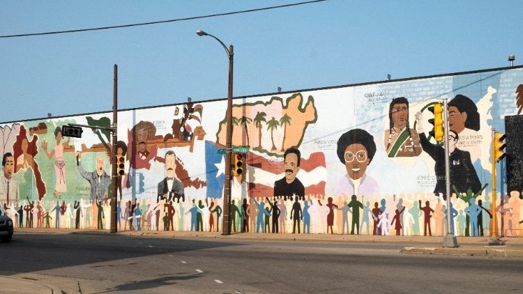 Mural showing Mexican, Puerto Rican, Native American and Black historic icons near Walker Square in Milwaukee