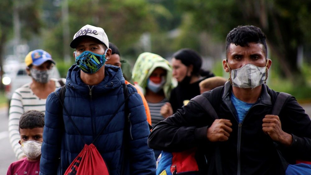 Venezuelan migrants walk towards the border between Venezuela and Colombia during the coronavirus disease (COVID-19) outbreak, in San Cristobal