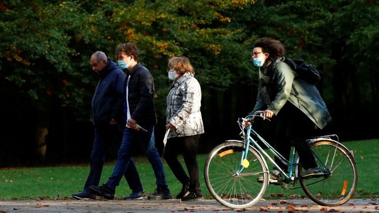 People wearing protective face masks in a park in Brussels