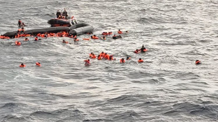 Migrants at sea waiting to be rescued by Spanish search and rescue ship Open Arms