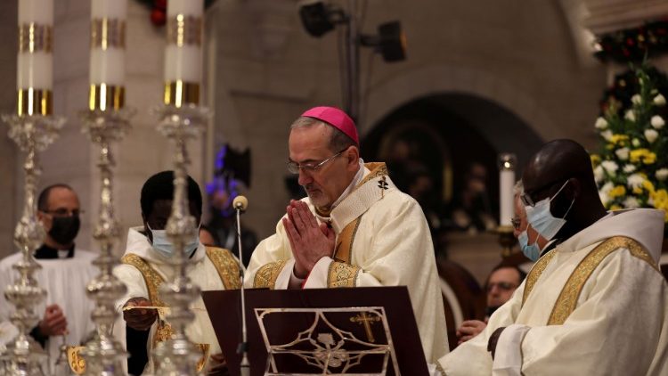 The Latin Patriarch of Jerusalem, Archbishop Pierbattista Pizzaballa, celebrates Mass in the Church of the Nativity in Bethlehem