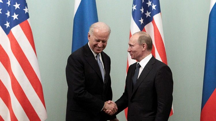 FILE PHOTO: Russian Prime Minister Putin shakes hands with U.S. Vice President Biden during their meeting in Moscow