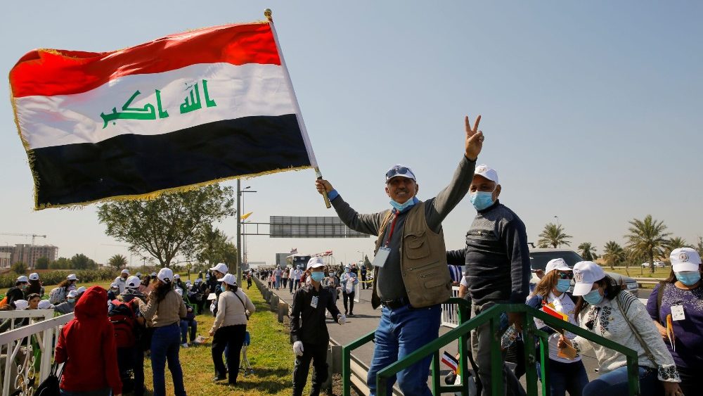 Iraqis wait for the arrival of Pope Francis