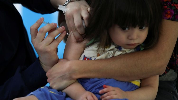 A child receiving a vaccine in Chile