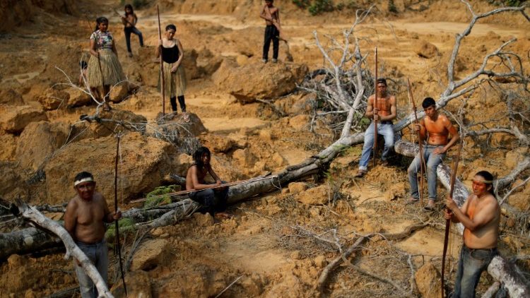 Mura indigenous people show a deforested area in indigenous lands in Brazil's Amazon rainforest near Humaita.