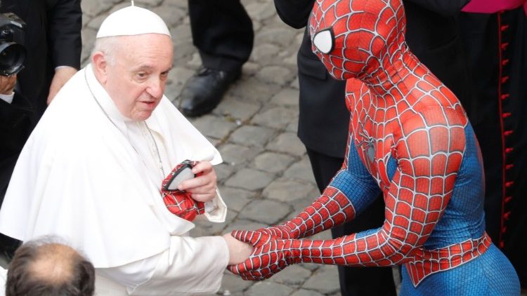 Pope Francis greets a person dressed as Spiderman, at the Vatican