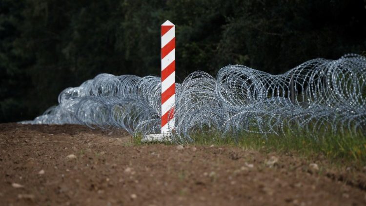 Poland's border sign is pictured at the Polish-Belarusian border near the village of Usnarz Gorny