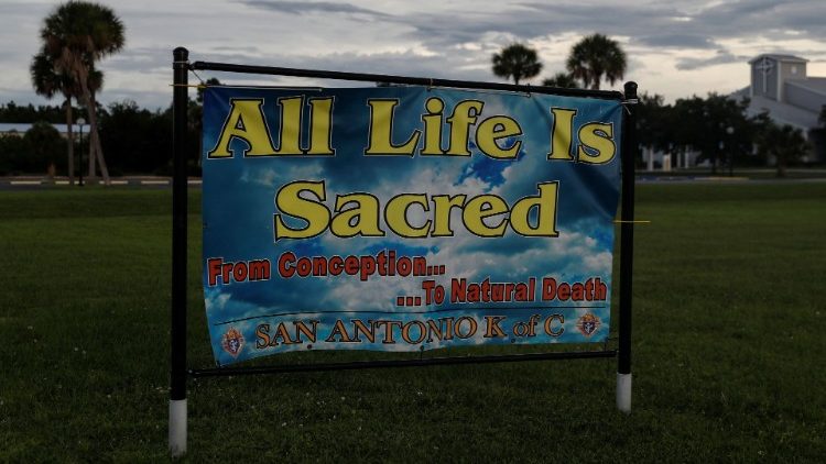 A sign reading "All Life Is Sacred" sits San Antonio Catholic Church in Port Charlotte, Florida