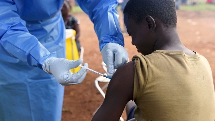 File photo: A Congolese health worker administers an Ebola vaccine to a boy