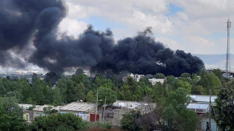 Smoke billows from the scene of an air strike, in Mekelle